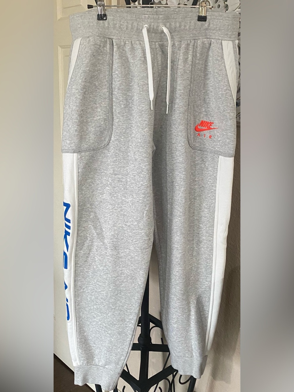 Nike Gray Joggers with White Side Panels and Red Logo